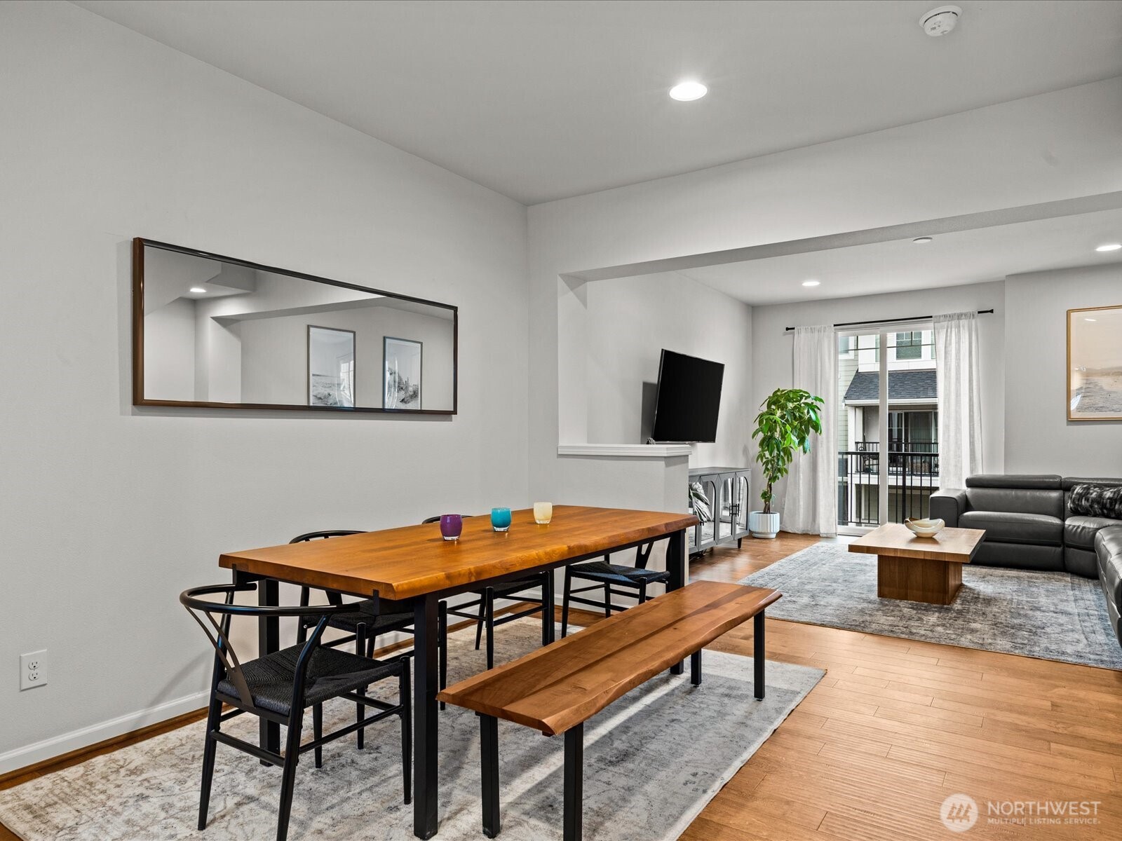 3400 Southwest Graham Street, Unit 703 Seattle, WA 98126 - Photo 10 of 28 a dining room with furniture and wooden floor