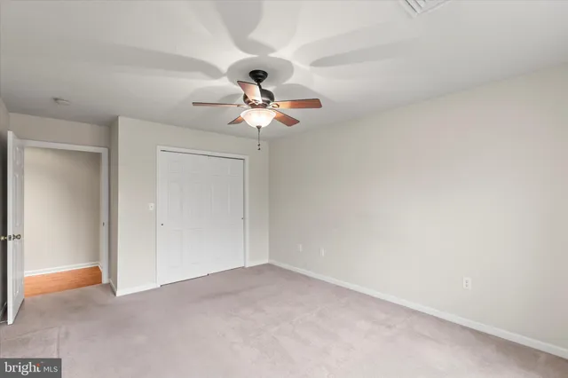 a view of a big room with carpet