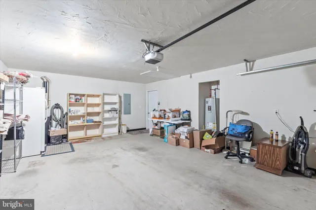 a view of a livingroom with furniture and white walls