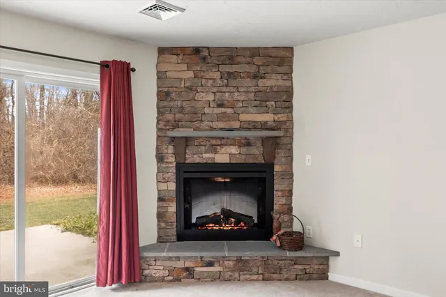 a living room with a fireplace