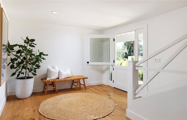 a living room with furniture and flowers