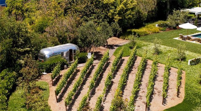 a backyard of a house with outdoor seating