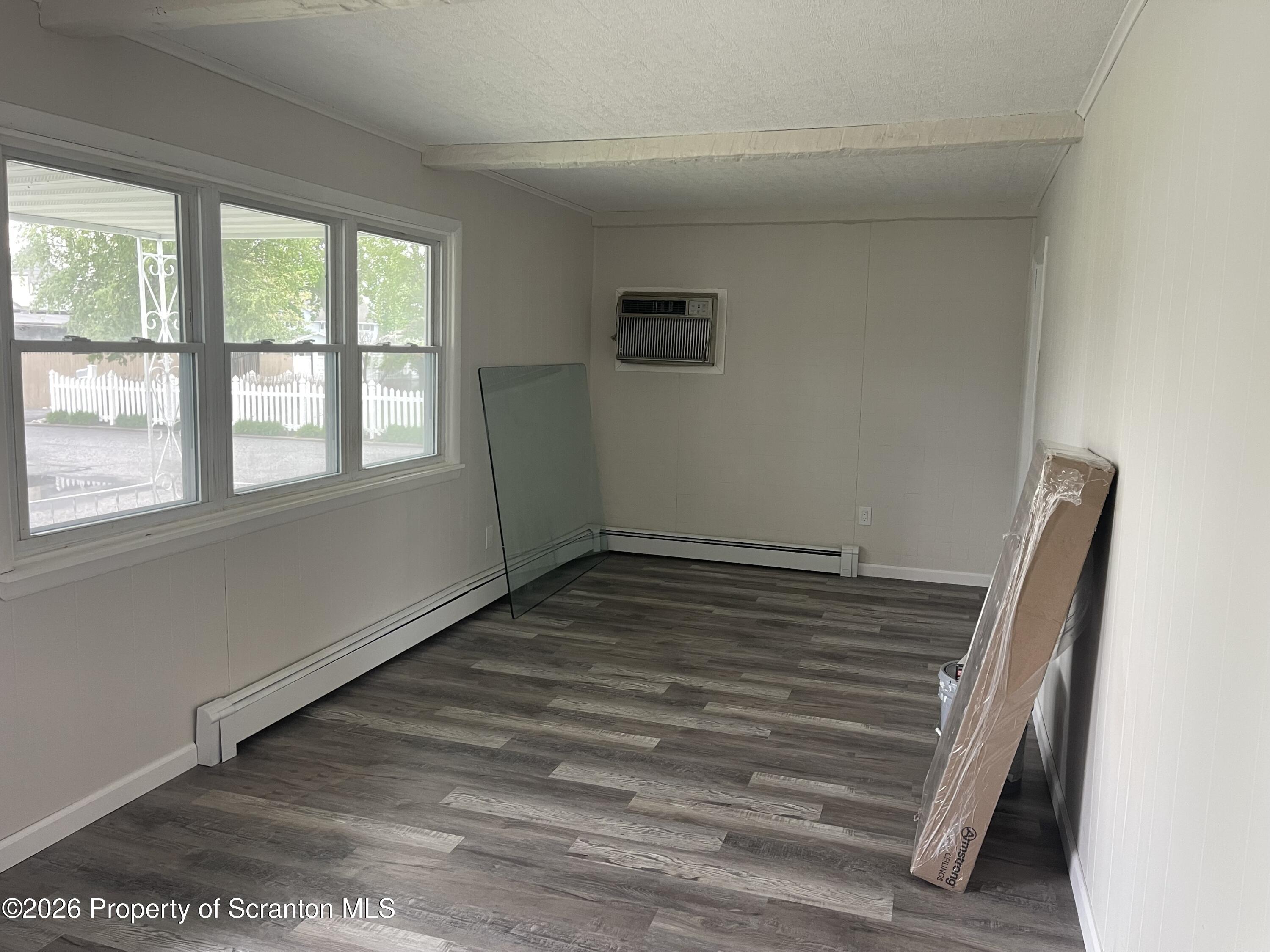 238 George Street Moosic, PA 18507 - Photo 11 of 23 a view of a room with wooden floor and window