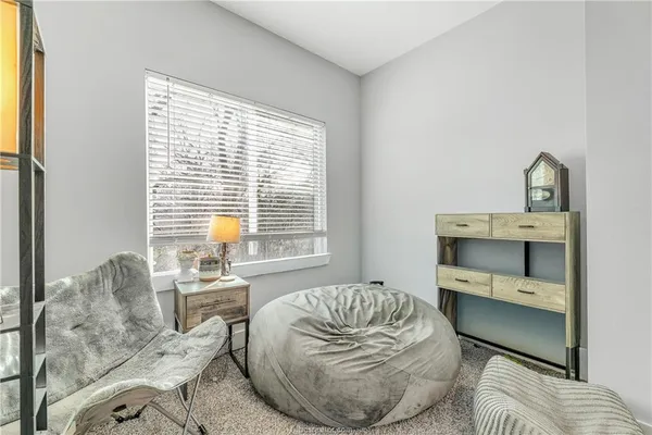 a room with a couch and a large window