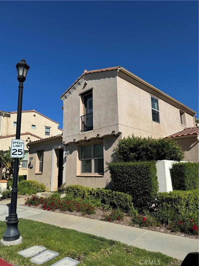 20323 Livorno Way Porter Ranch, CA 91326 - Photo 1 of 14 a front view of a house with a yard