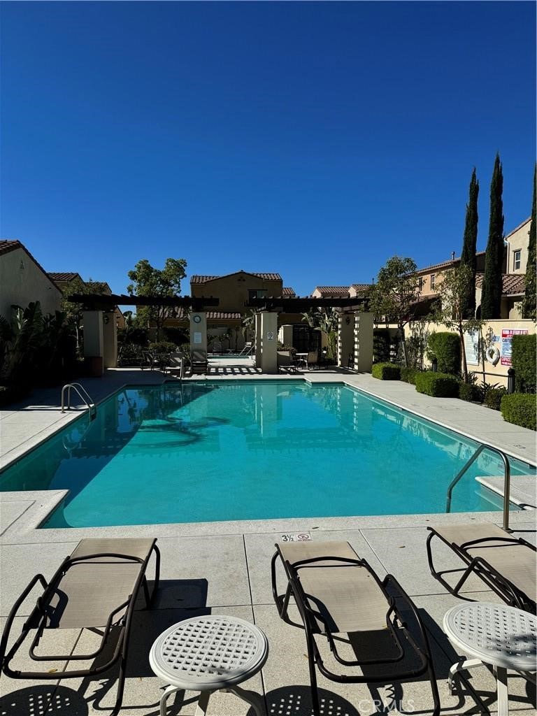 20323 Livorno Way Porter Ranch, CA 91326 - Photo 11 of 14 a view of a chairs and table in patio
