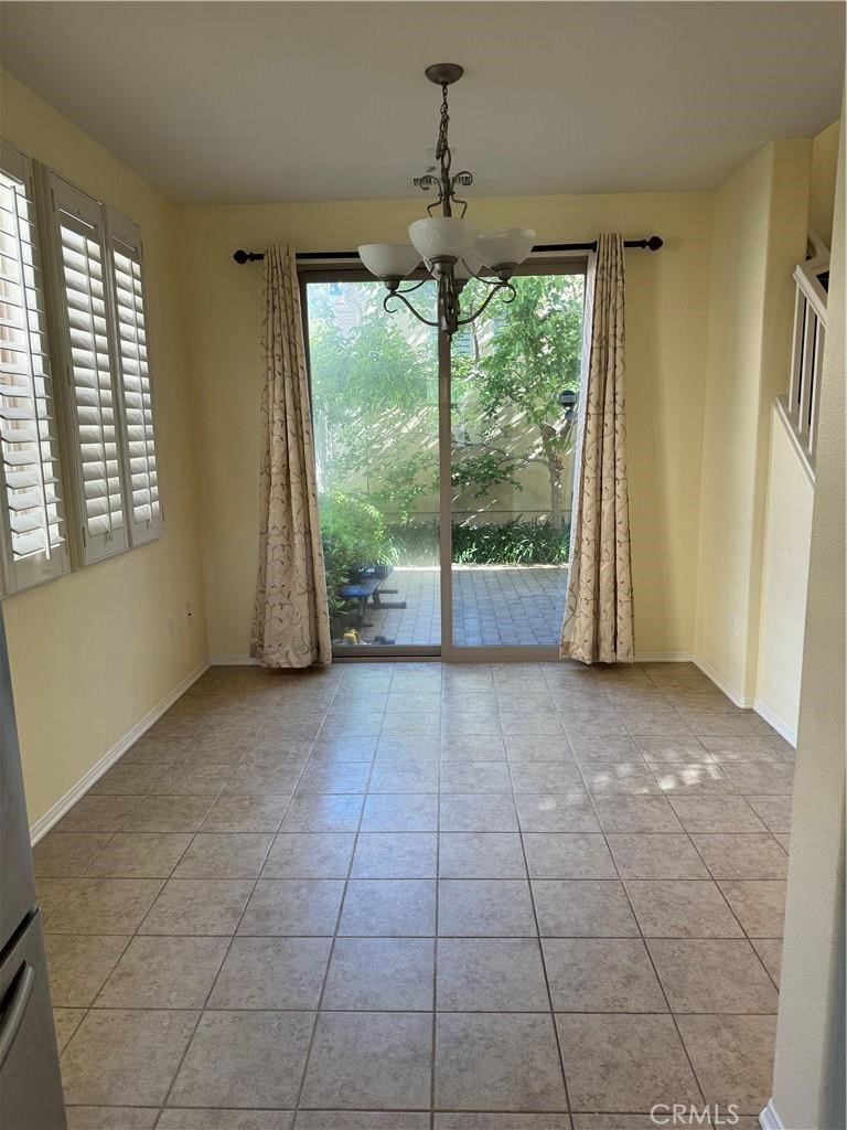 20323 Livorno Way Porter Ranch, CA 91326 - Photo 3 of 14 a view of an empty room with a window
