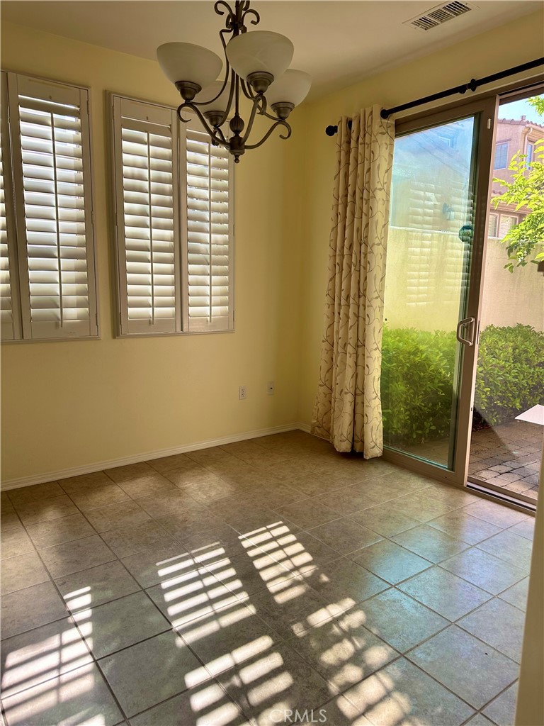 20323 Livorno Way Porter Ranch, CA 91326 - Photo 4 of 14 a view of an empty room with a window