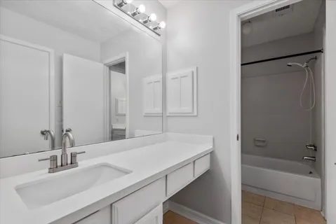 a bathroom with a sink and a bathtub