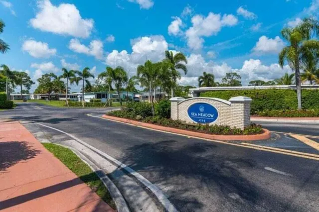 a street view with sitting space and garden space
