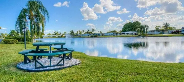 a view of a lake in between two of trees