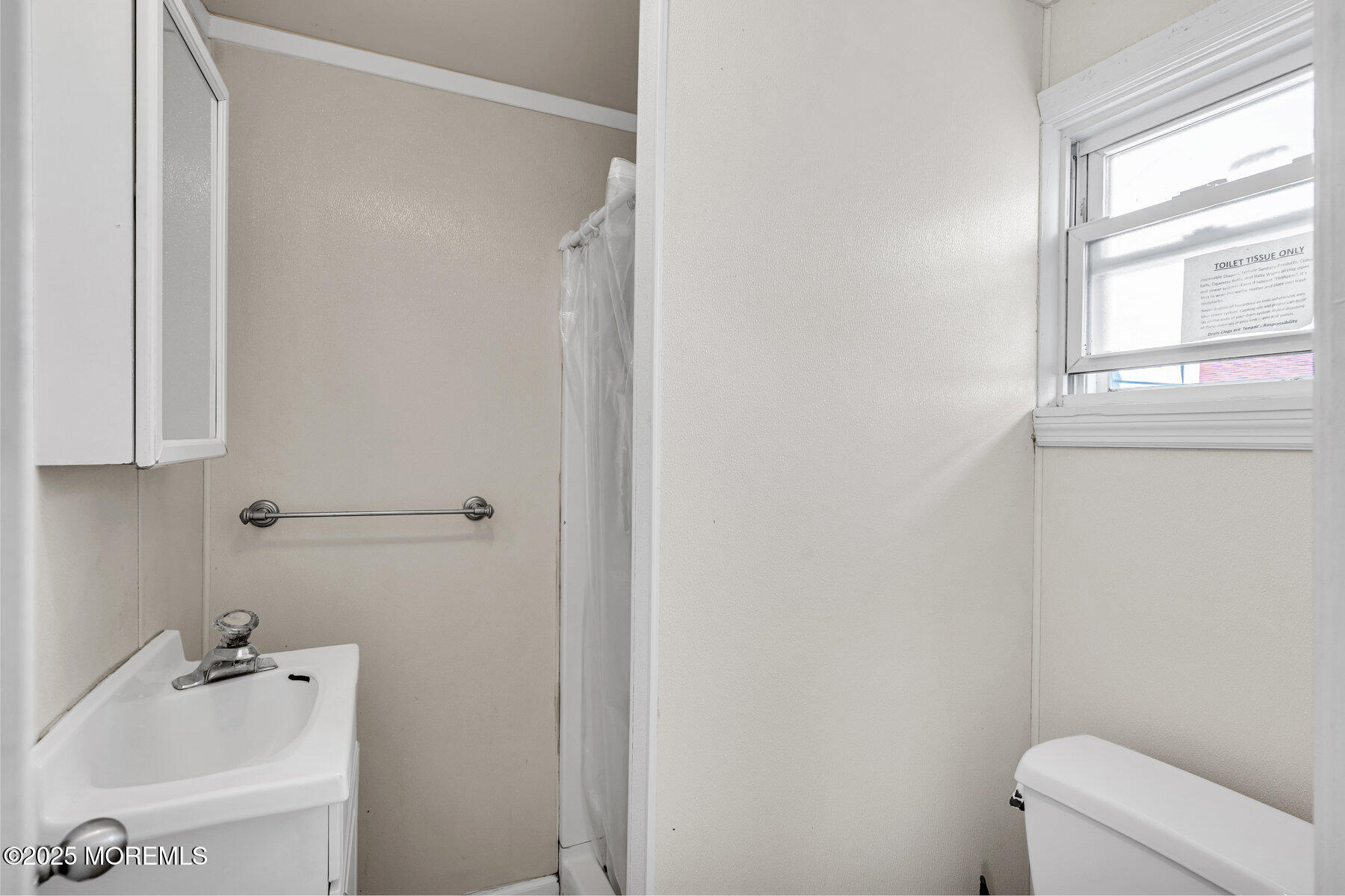 549 Brielle Road, Unit 1/2 Manasquan, NJ 08736 - Photo 9 of 10 a bathroom with a bathtub and sink