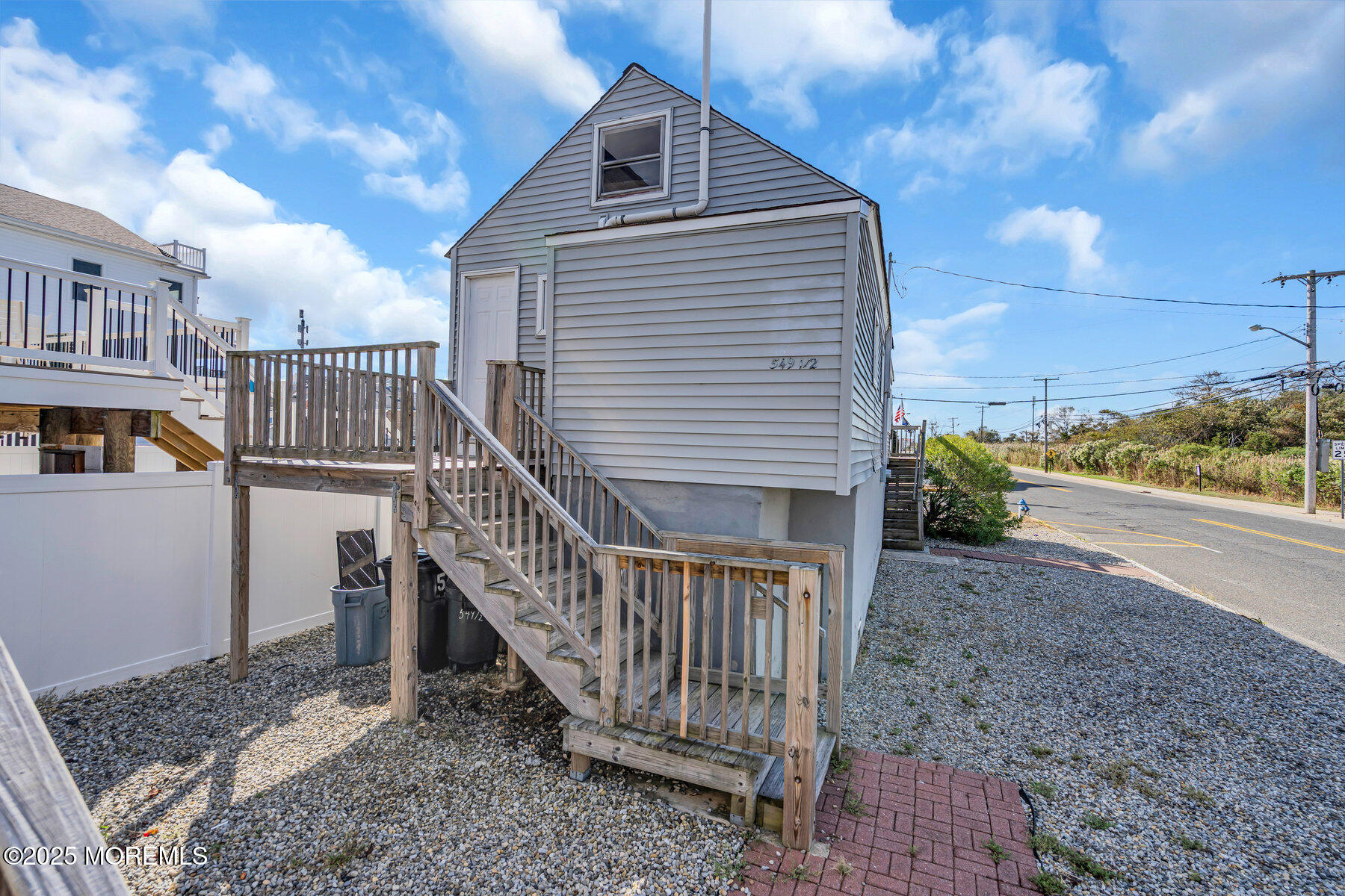 549 Brielle Road, Unit 1/2 Manasquan, NJ 08736 - Photo 10 of 10 a view of a house with wooden stairs