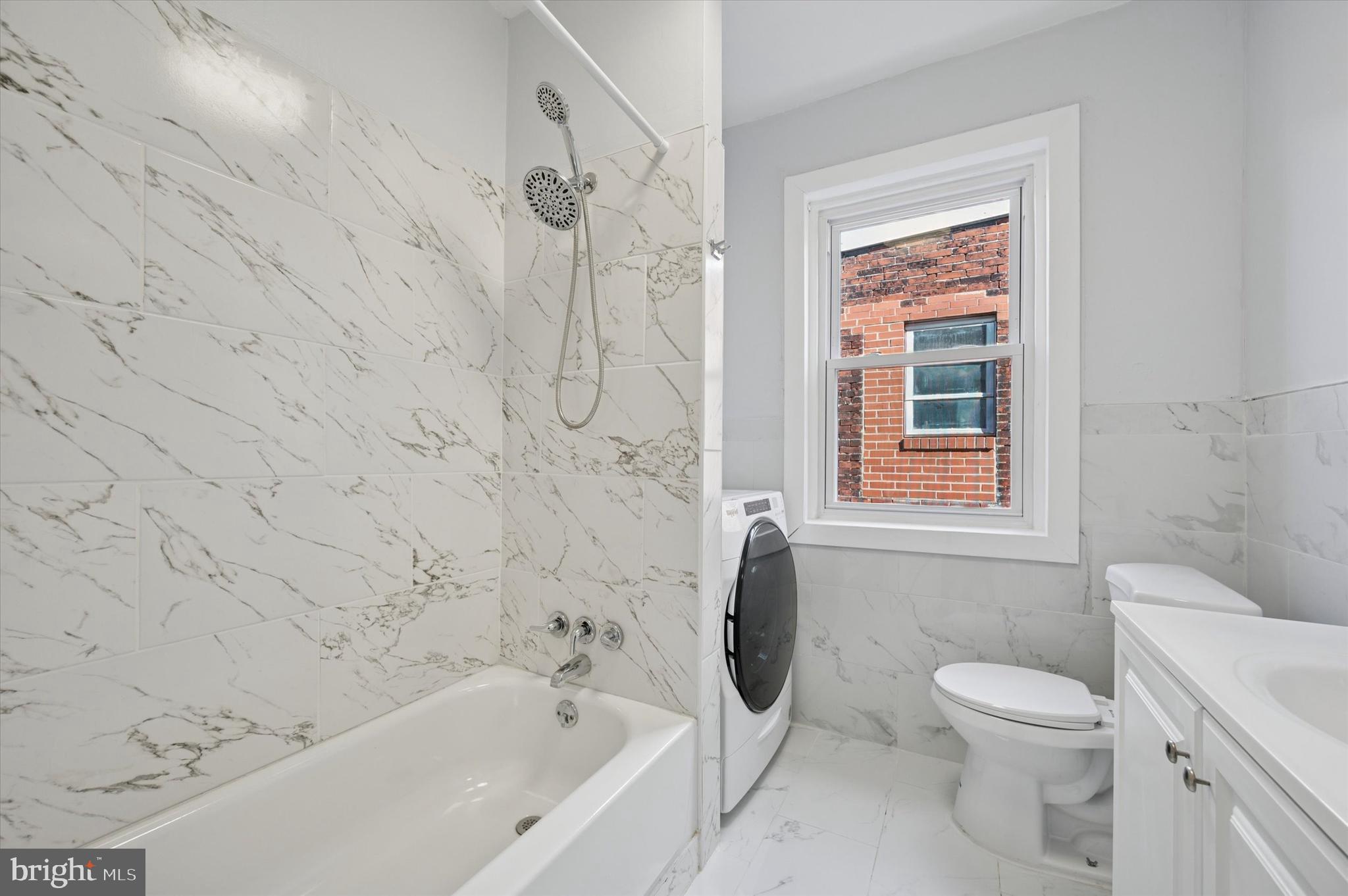 5031 Walnut Street, Unit 3 Philadelphia, PA 19139 - Photo 6 of 7 a bathroom with a toilet and a shower