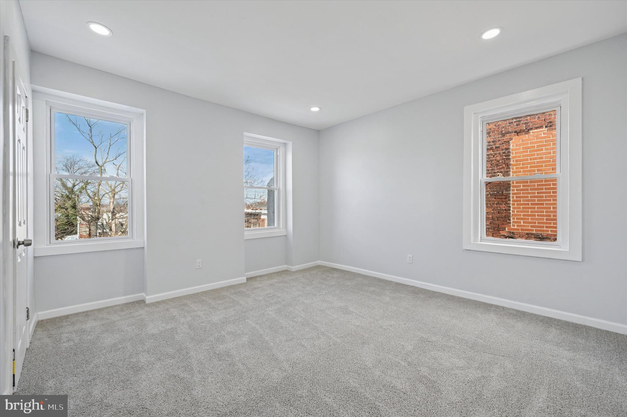 5031 Walnut Street, Unit 3 Philadelphia, PA 19139 - Photo 7 of 7 an empty room with windows