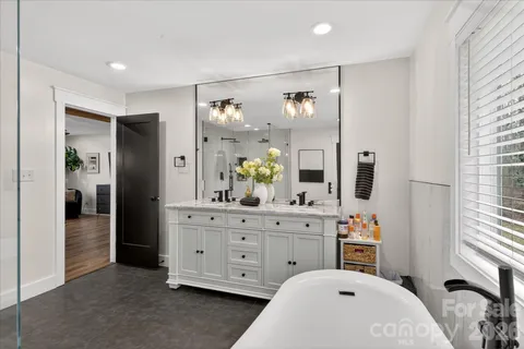 a bedroom with a bed and a dresser in it