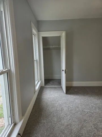a view of an empty walk in closet