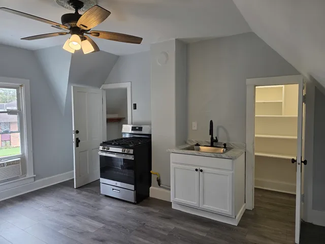 a kitchen with a stove and a refrigerator