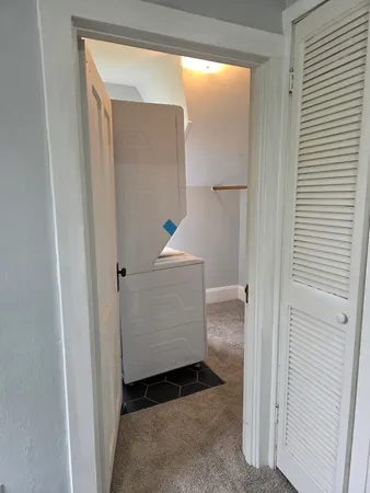 a view of hallway with wooden floor