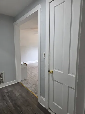 a view of a chandelier fan in a room
