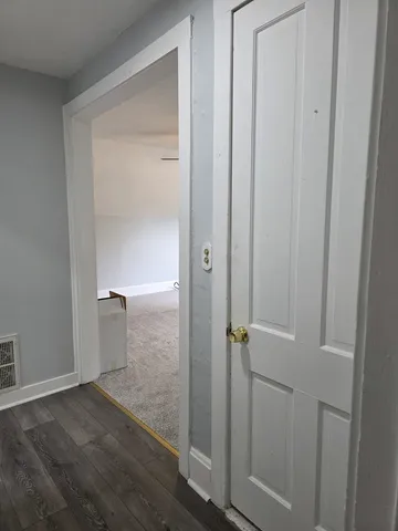 a view of a chandelier fan in a room