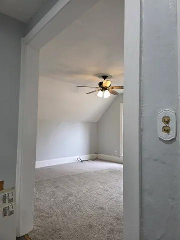 a view of a chandelier fan in a room