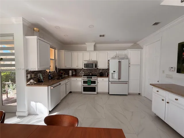 a view of parking garage with cars