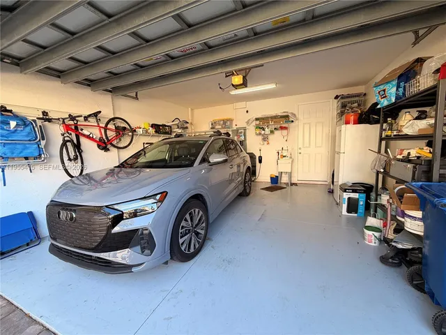 a bathroom with a toilet a sink and a mirror