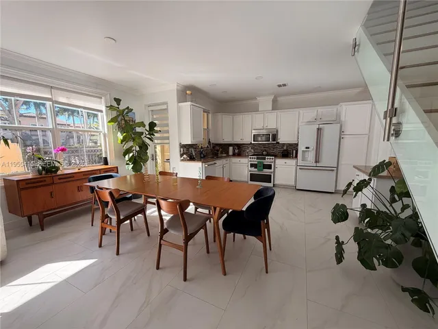 a room with wooden floor and furniture
