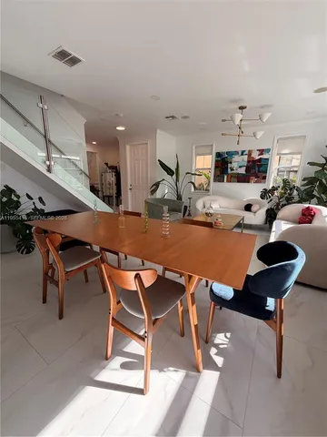 a bedroom with bed and a flat screen tv