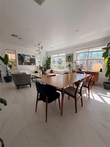 a large bathroom with a tub sink and mirror
