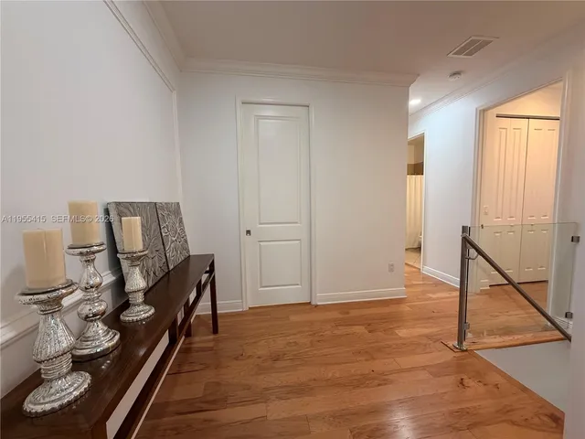 a bedroom with a bed and a mirror