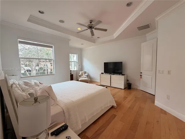 a view of swimming pool with outdoor seating and plants