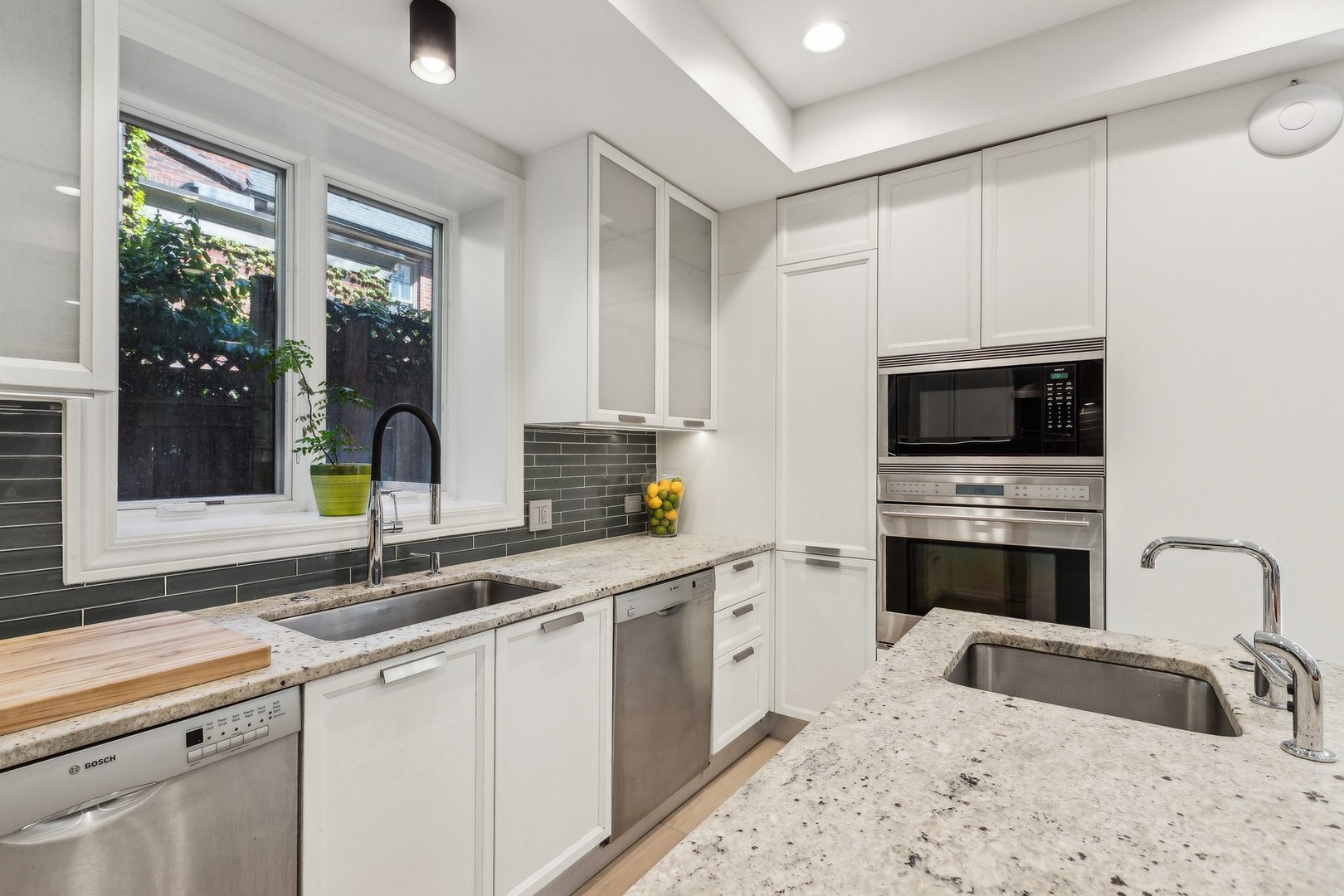 579 West Hawthorne Place Chicago, IL 60657 - Photo 22 of 65 a kitchen that has a sink and a stove in it