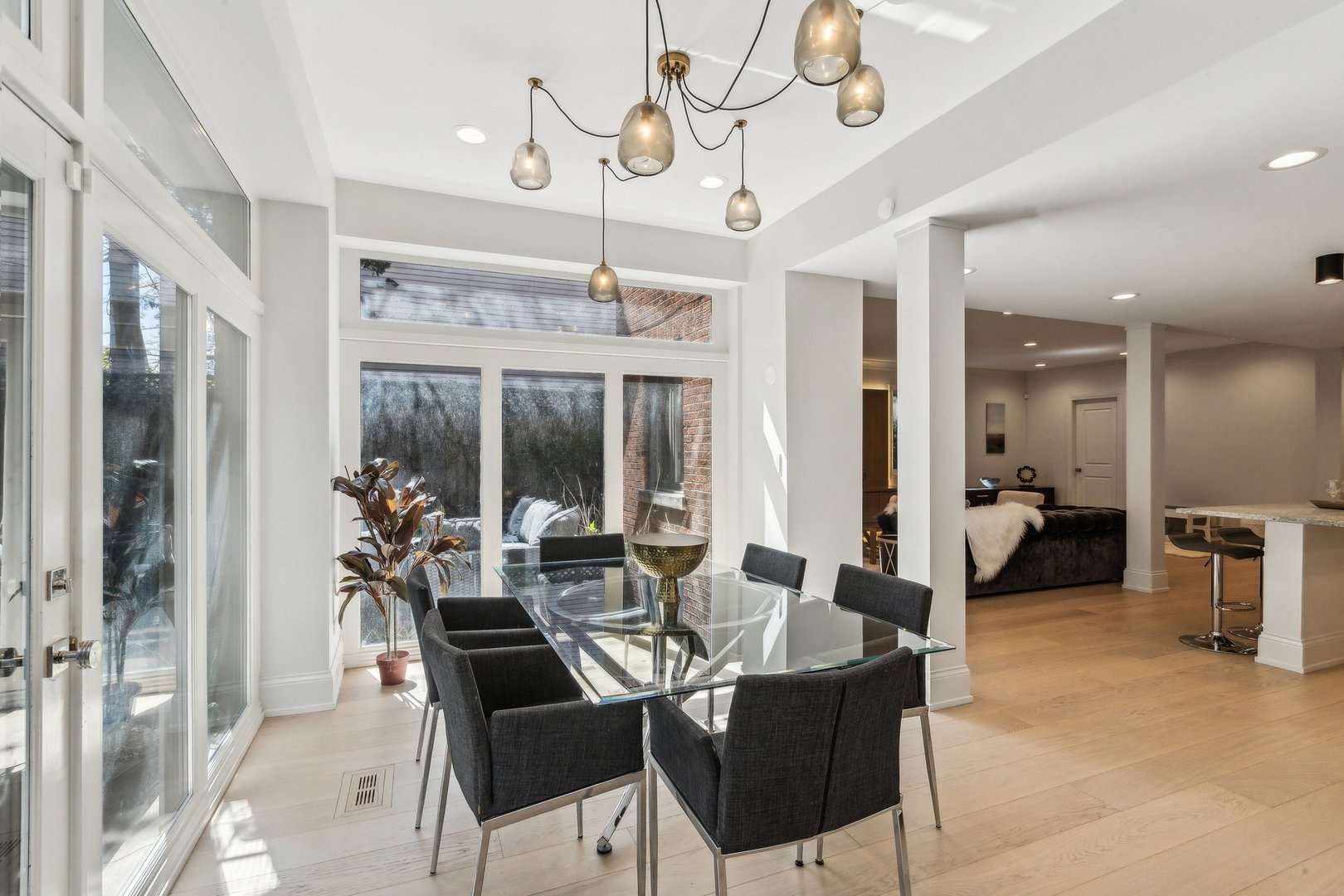 579 West Hawthorne Place Chicago, IL 60657 - Photo 25 of 65 a view of a dining room with furniture large window and chandelier