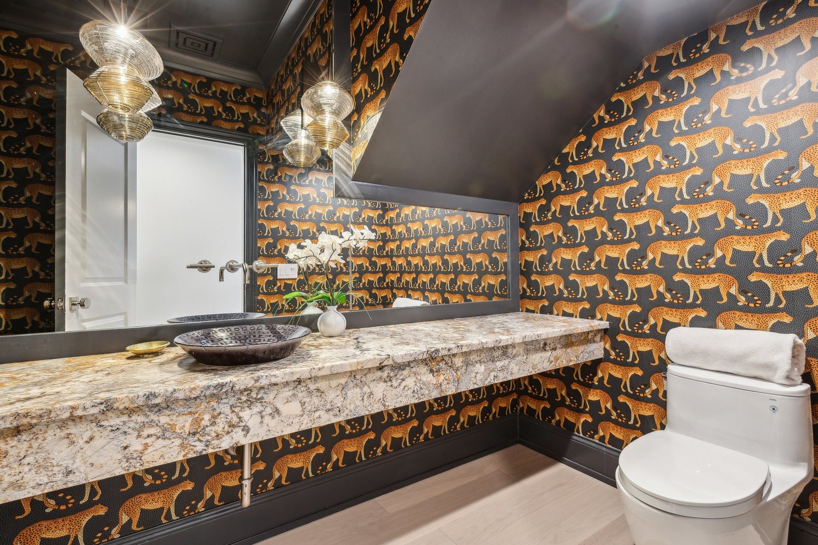 579 West Hawthorne Place Chicago, IL 60657 - Photo 26 of 65 a bathroom with a granite countertop sink and a toilet