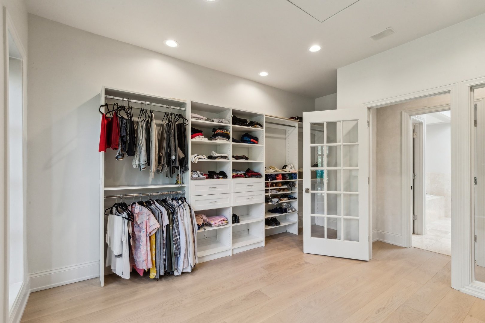 579 West Hawthorne Place Chicago, IL 60657 - Photo 36 of 65 a view of walk in closet with clothes and shoes