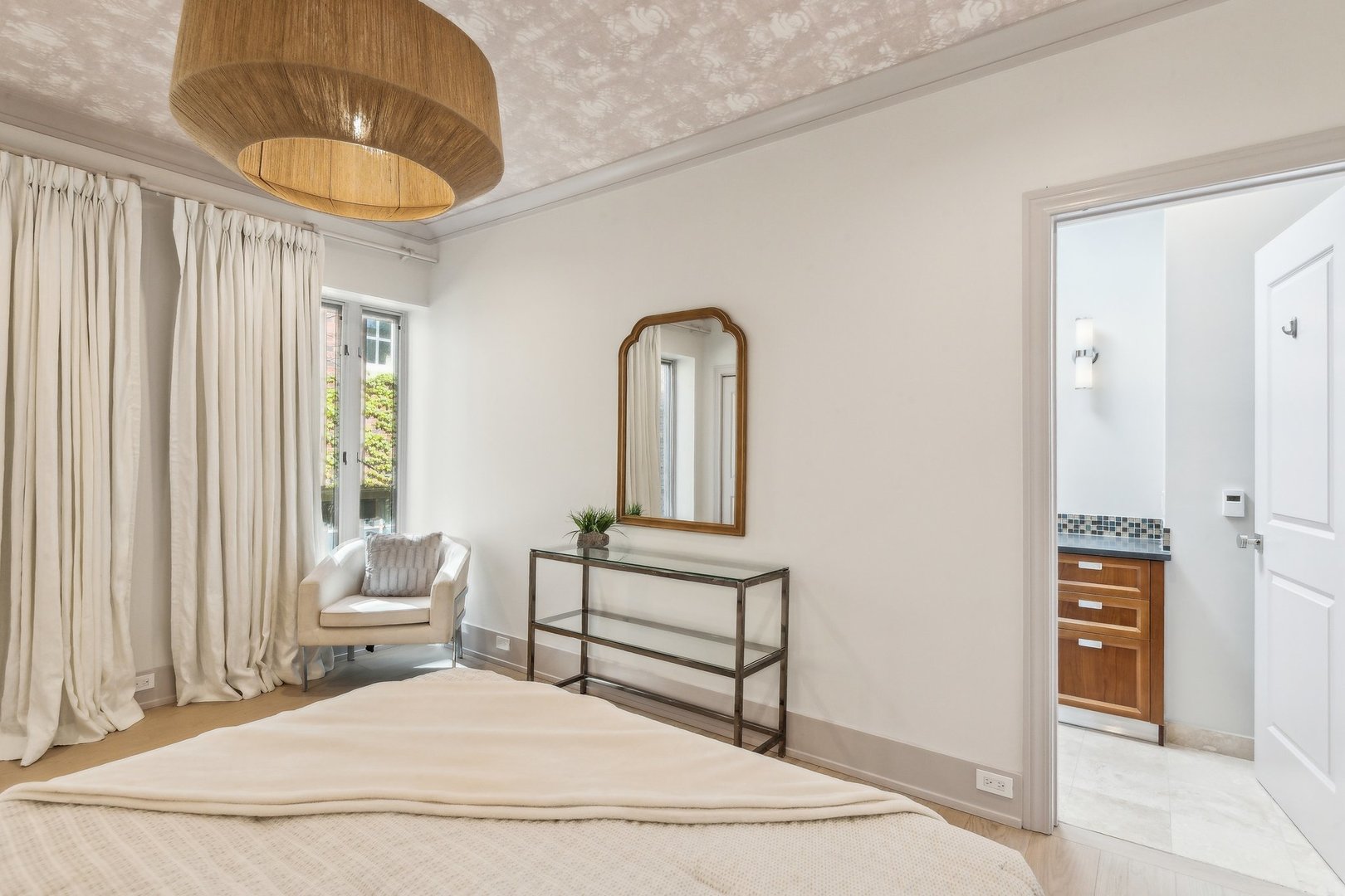 579 West Hawthorne Place Chicago, IL 60657 - Photo 41 of 65 a bedroom with a bed and a chandelier