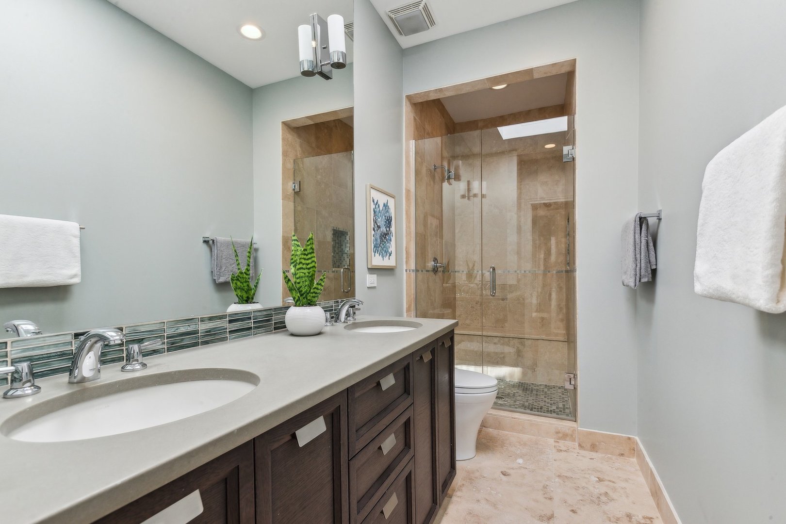 579 West Hawthorne Place Chicago, IL 60657 - Photo 51 of 65 a bathroom with a sink a toilet and shower