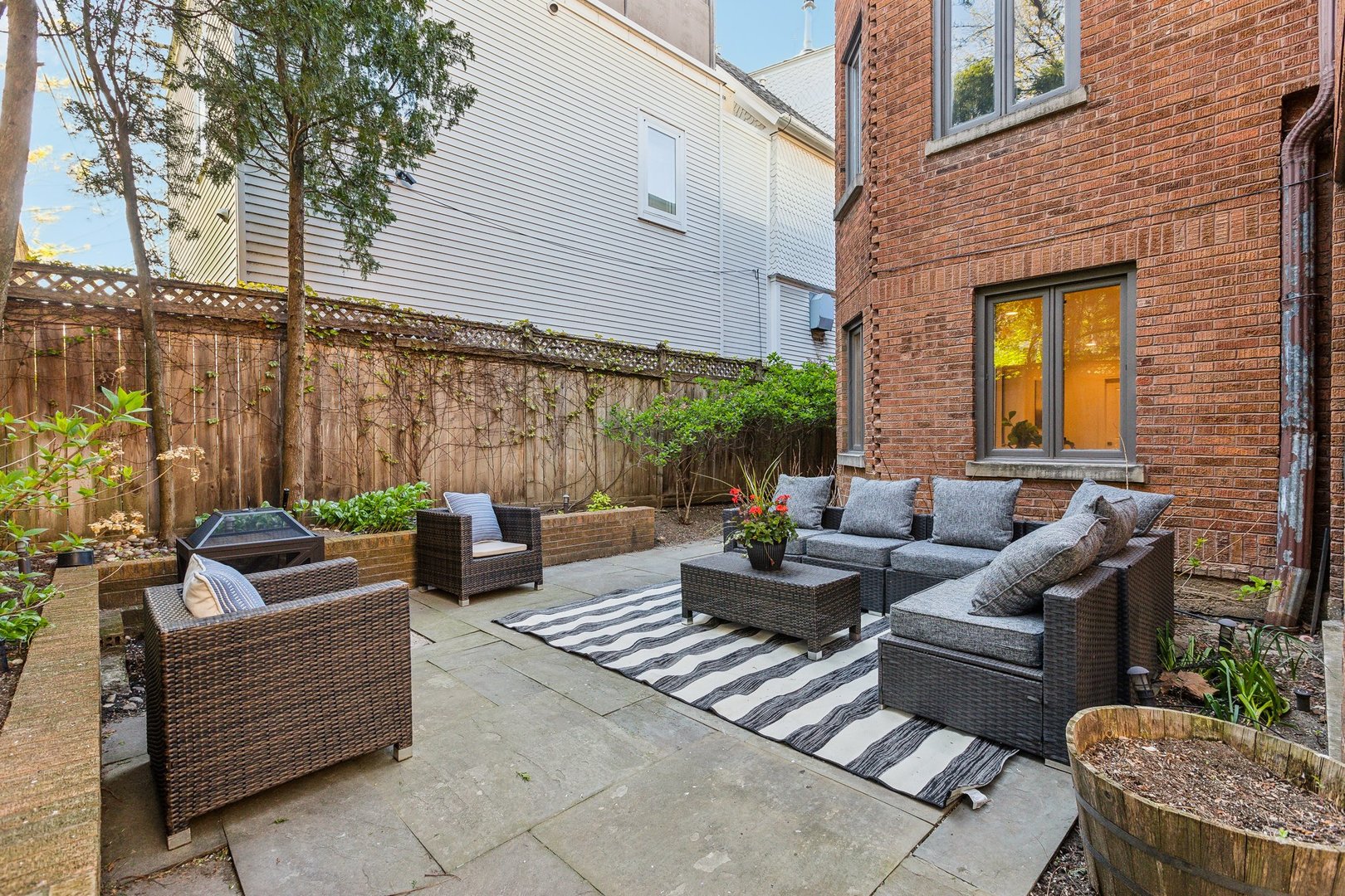 579 West Hawthorne Place Chicago, IL 60657 - Photo 55 of 65 a view of a patio with couches chairs and a potted plant