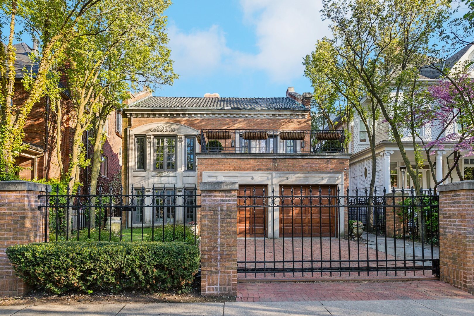 579 West Hawthorne Place Chicago, IL 60657 - Photo 62 of 65 front view of a house with a iron gate