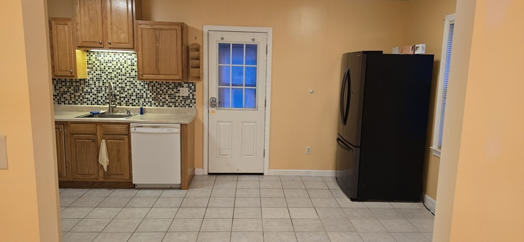 403 South Main Street, Unit 1 Sharon, MA 02067 - Photo 6 of 16 a view of cabinets with wooden floor