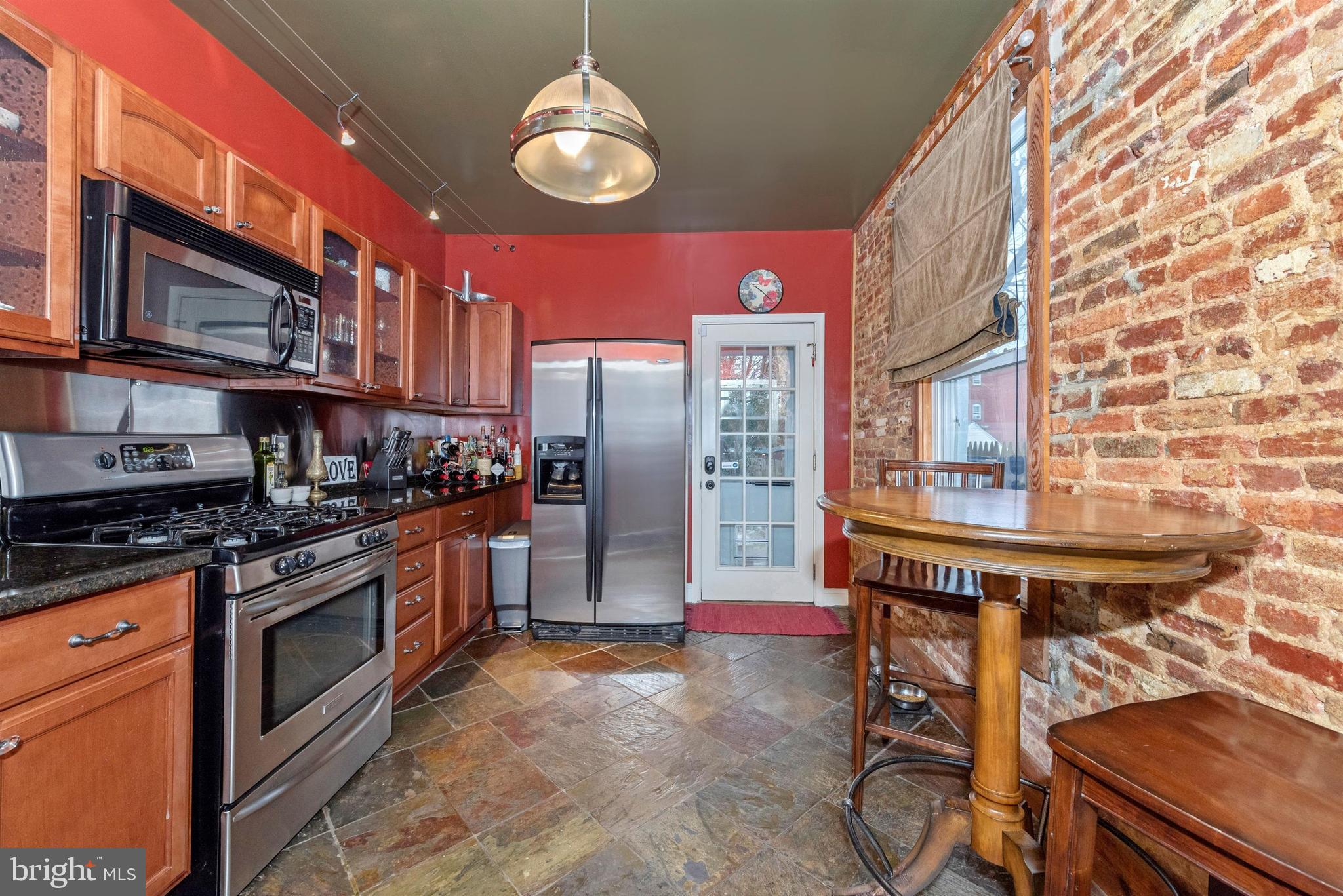 207 Center Street Frederick, MD 21701 - Photo 14 of 36 Exposed brick wall - a great design feature.