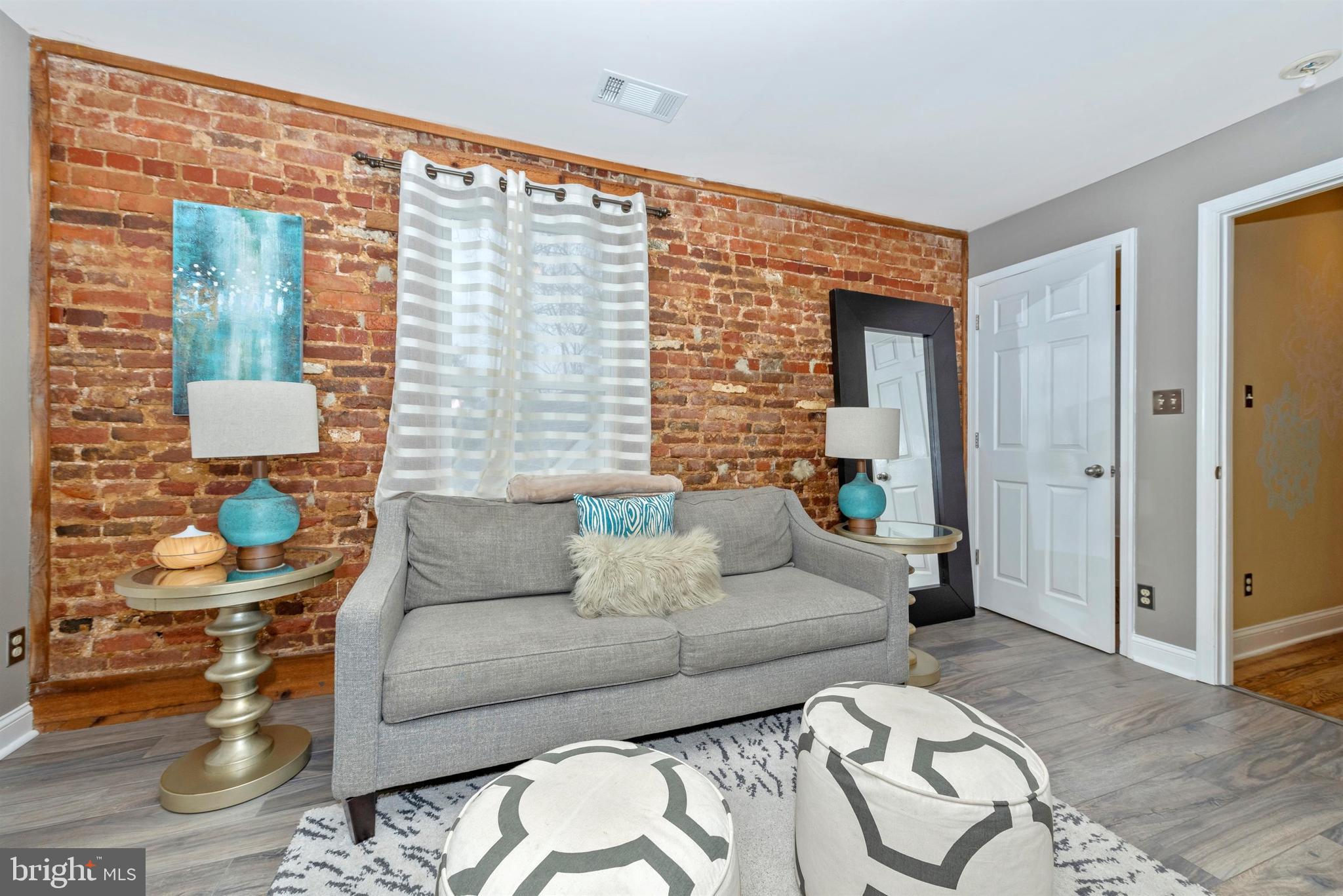 207 Center Street Frederick, MD 21701 - Photo 24 of 36 Second master suite - exposed brick wall.