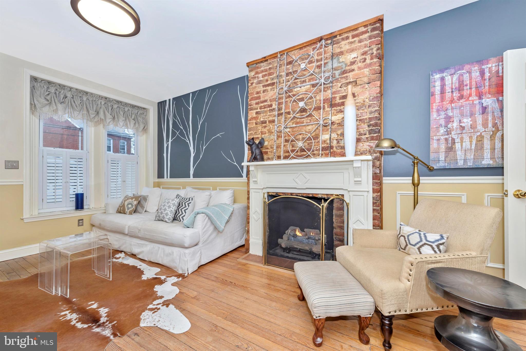 207 Center Street Frederick, MD 21701 - Photo 4 of 36 Living Room - Gas fire place with brick chimney.
