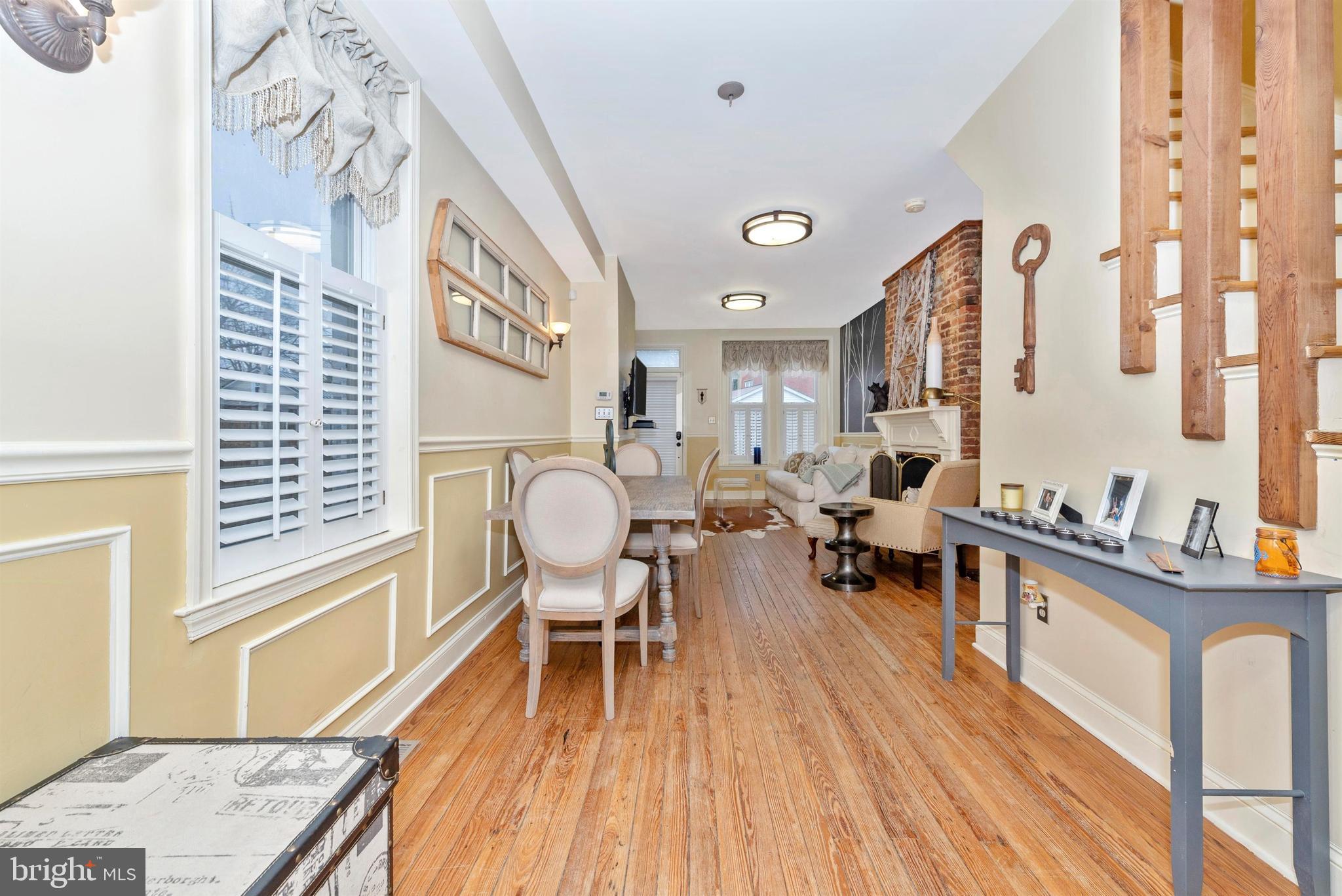 207 Center Street Frederick, MD 21701 - Photo 10 of 36 View of dining room and living room.