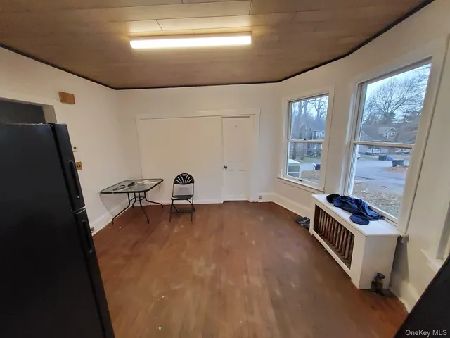 a view of an empty room with windows