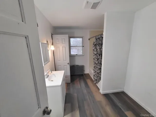 a view of bathroom with bathtub and toilet