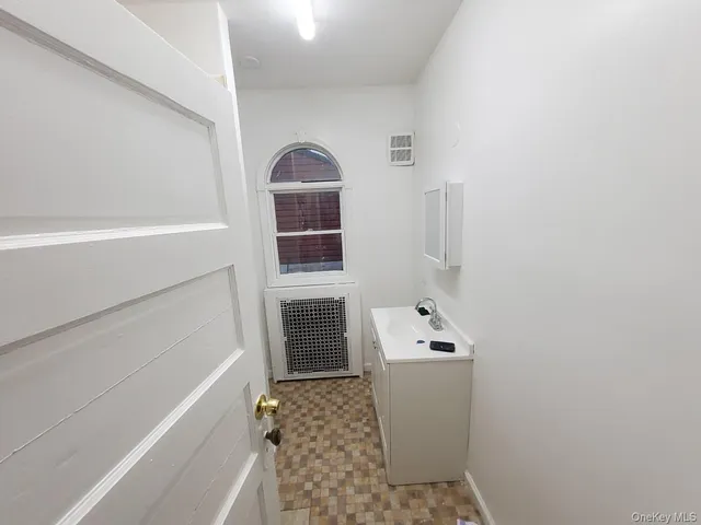 a bathroom with a sink and mirror