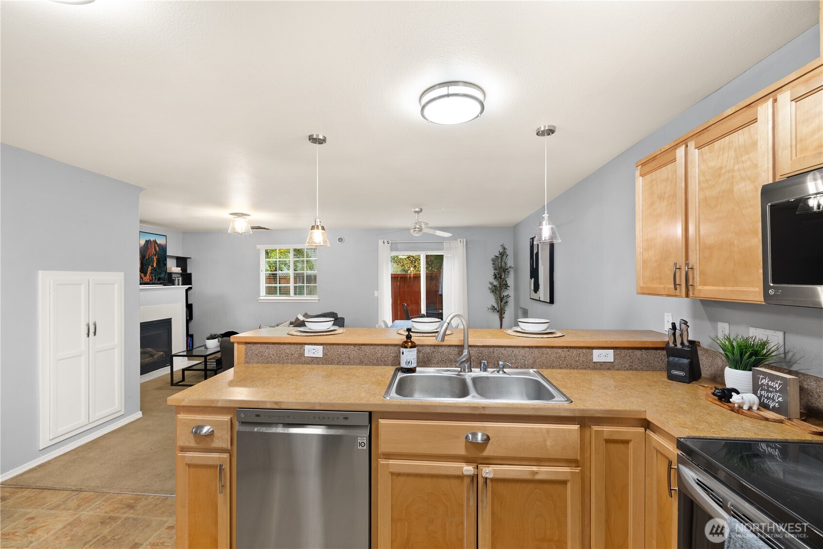 16015 123rd Ave Court East Puyallup, WA 98374 - Photo 12 of 26 a view of a kitchen sink stove and microwave